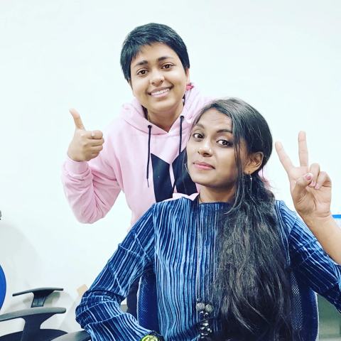 Two lab members posing for a photo in the lab.