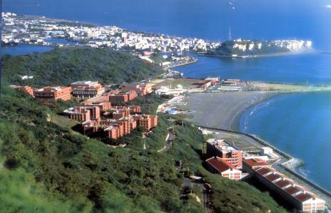 Aerial view of the NSYSU campus along the coastline.
